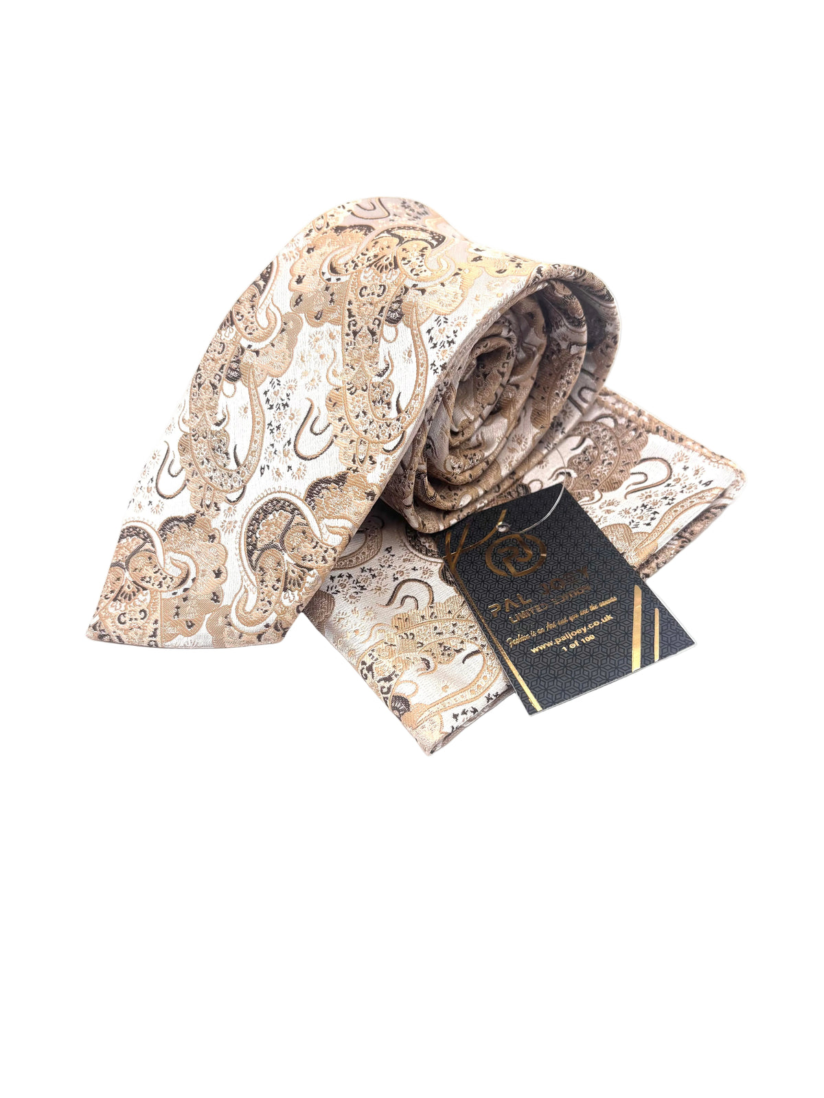 A rolled and folded necktie with a beige, brown, and white paisley pattern, accompanied by a black brand tag with gold lettering, set against a plain white background.