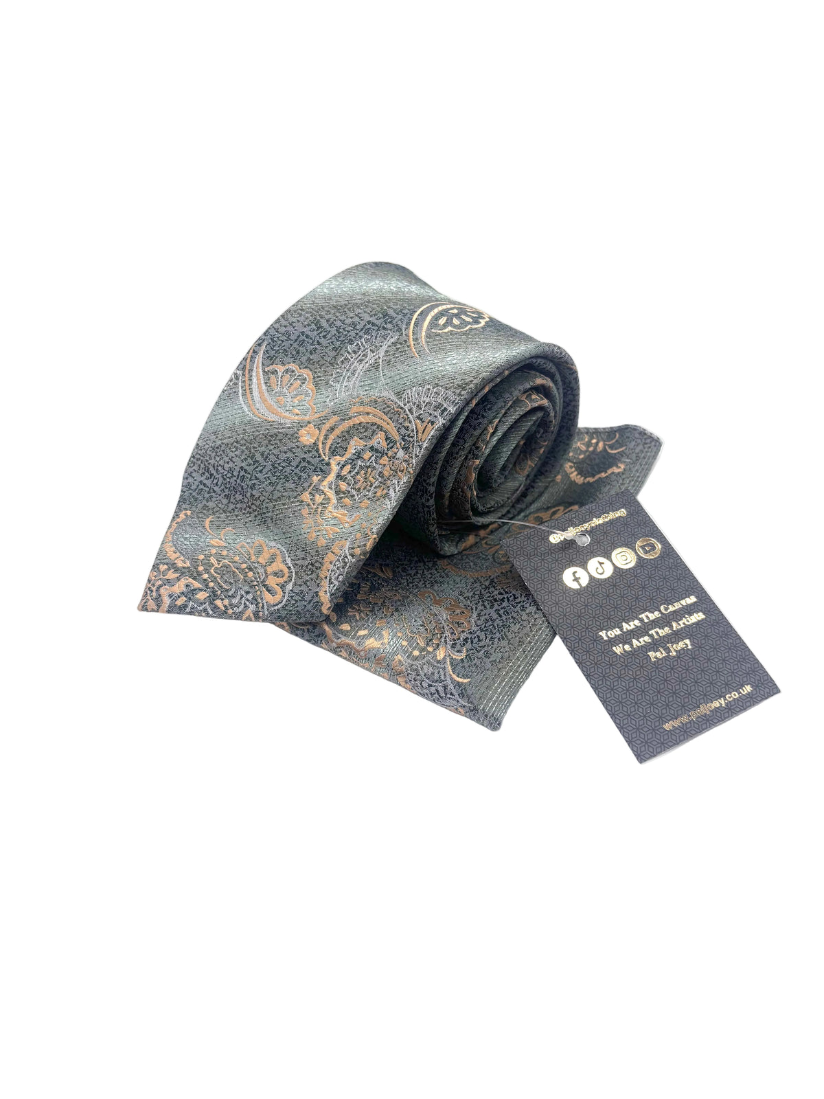 A rolled necktie with a paisley pattern in muted blue-gray and gold, shown with a branded hangtag on a plain white background.